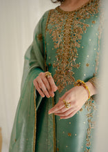Load image into Gallery viewer, Green embroidered traditional outfit with gold details on a plain background
