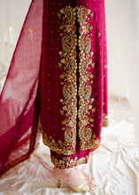 Load image into Gallery viewer, Maroon traditional outfit with gold embroidery on a white fabric background
