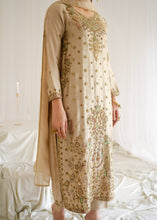 Load image into Gallery viewer, Beige embroidered traditional outfit on a white background
